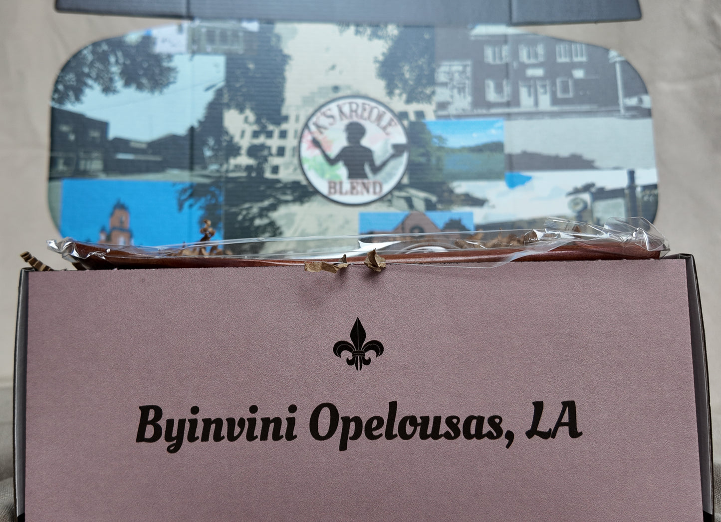 K's Kreole Seasoning gift set with 'Byinvini Opelousas, LA' text and a blurred background
