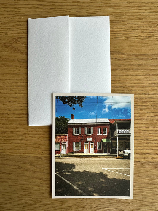Greeting card with a printed photo of a historic Louisiana  building on a wooden surface